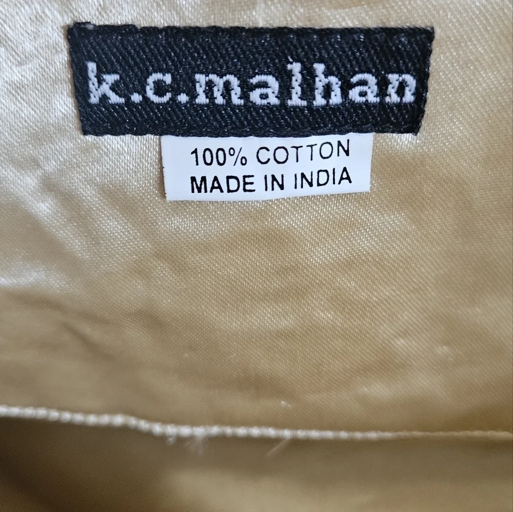 K.C.MALHAN Ikat Printed Woven Cloth Dumpling Chain Bag In Orange/brown Multi.